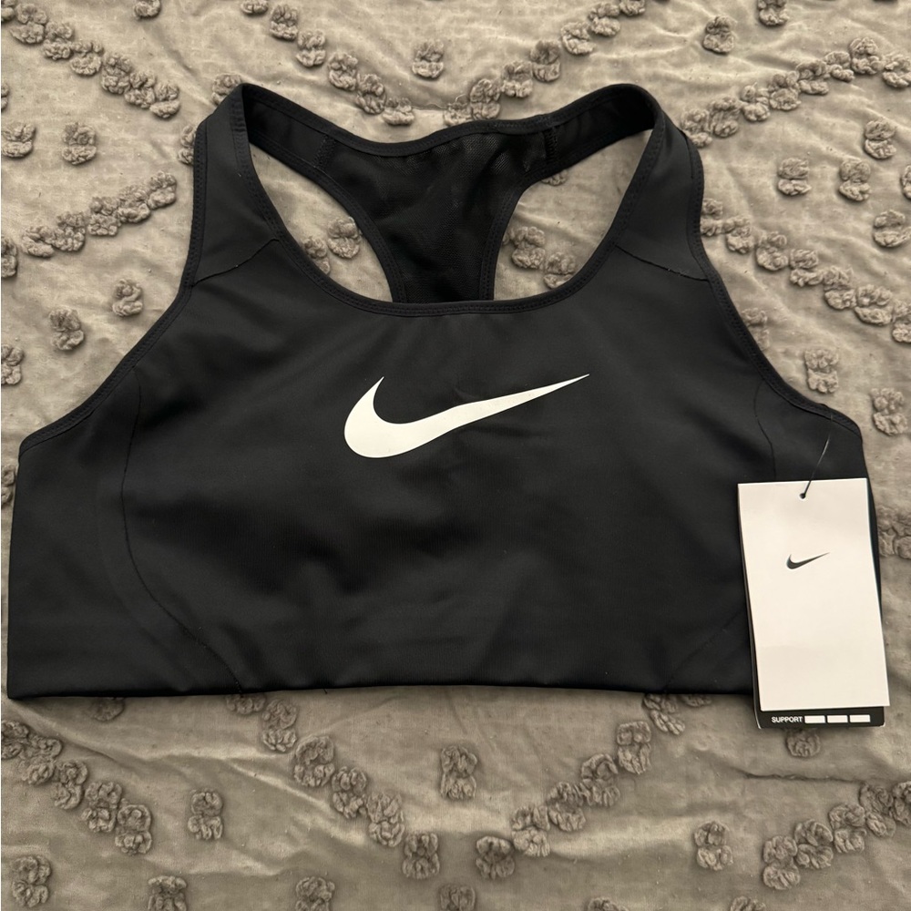 Nike women's sports bra, size L, color black, tags attached never worn.